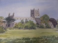 A watercolour on paper depicting Tewkesbury Abbey, signed by the artist G Shelley, framed and