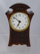An Oak Mantle Clock R & C.S., Paris, enamelled face approximately 22 cms high.