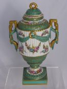 A French Sevres-style fluted porcelain vase and cover, the vase hand painted with floral garlands