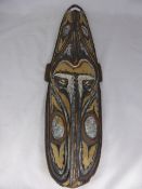 A Boy`s Initiation Mask having cowry shell detail, approx. 74 cms in length.