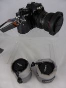 A Minolta X/700 35mm camera together with misc. lenses incl. 28-70 mm, 28 mm, 50 mm, together with