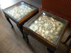 One large and two small tables containing further shell display art in the form of a coffee table