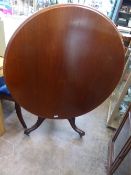 A Victorian Mahogany Circular Tilt Top Table, on turned tripod base, three with the original