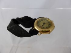 A lady`s 18ct gold cased wristwatch, case stamped W & S.