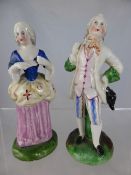 Two Continental Porcelain Figures, depicting a man and a woman in their finery.