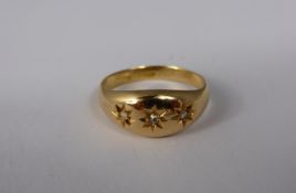 A gent`s 18 ct gold three stone diamond ring, approx. 3.5 gms.