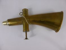 A Vintage Brass Single Valve Musical Hand Horn, possibly Hungarian.