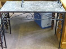 A wrought iron marble topped occasional table, the base having scroll work decoration, approx. 100