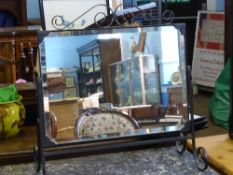 A wrought iron framed mirror having bevelled glass with scroll work decoration, approx. 63 x 67 x