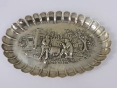 A Solid Silver Trinket Dish depicting figures in an orchard with scalloped edge, William IV dated