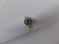 A Lady`s 9ct Blue Stone and Diamond Ring, approx 2 gms, size P.