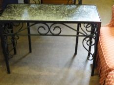 A wrought iron marble topped occasional table, the base having scroll work decoration, approx. 78 x