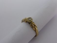 A lady`s 9 ct gold and diamond solitaire ring. Approx. 1.8 gms.