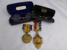 Two pairs of antique spectacles together with a Great War Medal 1814 - 1918 86744 Dvr. H Trigg and