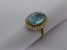 A lady`s 9 ct yellow and white gold diamond and blue stone ring. Approx. 4.9 gms.