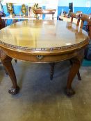 Antique Mahogany Wind Out Dining Table, the legs decorated with garland carving and ball and claw