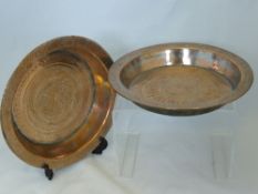 Two Antique North African Copper Dishes, one dish etched with the figure of a lion in a Paisley