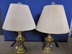 Pair of Brass Decorative Lamp Bases, together with cream shades.