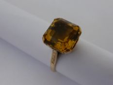 A Lady`s Citrene and Gold Dress Ring set with a single square cut Citrene stamped 14 ct