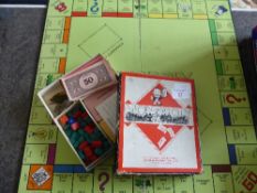 A Vintage Monopoly Board and Accessories together with Vintage Playing Cards including `Can you