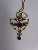 Lady`s 9ct Gold Amethyst and Seed Pearl Pendant suspended from a fine chain, approx 3.9 gms.