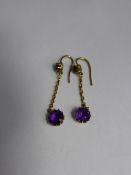 A pair of Lady`s Gold and Amethyst Double Drop Earrings, for pierced ears, approx 1.4 gms