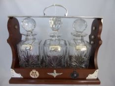 Presentation Tantalus, comprising of three Edinburgh Crystal Decanters with three solid silver