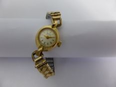 A Lady`s 18 ct Gold Buren Wrist Watch with Baton Dial on rolled Gold expanding bracelet case number