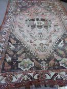 An antique Iranian tribal Rug being woollen, Tanjan with birds, approx. 306 x 211 cms.