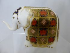 Royal Crown Derby Figure of an Elephant, red stamp to base numbered LIII, 9.5 cms high.