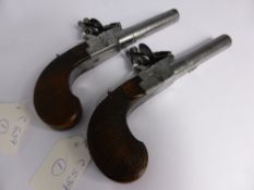 A pair of flintlock pocket pistols, circa 1810 with secret triggers and sliding safeties, the