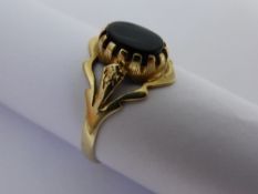 A Lady`s Black Onyx Dress Ring 9 ct Gold approximately 1.5 gms.