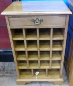 A Bespoke Oak Wine Rack with Single Drawer, with sixteen bottle compartments and three for