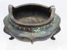 An Antique Oriental Highly Decorated Cloisonné Censor, of segmented form on three feet.