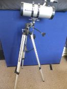 A Celestron Powerseeker 127 Telescope, on an adjustable tripod base, model no. 21049, D = 127 mm.