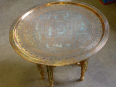 Copper and Silvered Tray Table, supported on an ornately decorated stand.