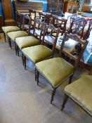 A set of six Edwardian mahogany dining chairs, the chairs having carved backs depicting swags on