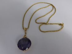 An 18 carat Gold Pendant and Chain, the hand made Pendant comprising a circular faceted Alexandrite