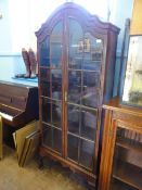 An Antique Mahogany 4-shelf Display Cabinet on four Cabriole feet,  having an arched top and astral