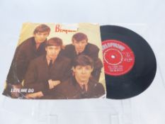 A Beatles 45 rpm record ?Love Me Do ?and ?P. S. I Love You ?on the B side, the record being on the