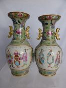 A Pair of Circa 19th century Famille Verte Vases, the vases depicting brightly coloured birds and