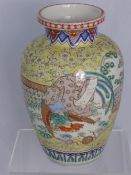 A 19th Century Chinese baluster vase on yellow ground depicting a sage seated on a phoenix in