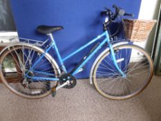 A lady`s blue Raleigh Pioneer Prestige bicycle having twelve gears.