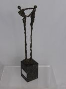 A Bronze Study of a Couple in a Dance Pose, 21 cms in height, signature to base on a marble plinth.