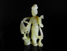 Chinese 20th Century Pale Celadon Jade Figure of Guanyin, the fine figure having ornately carved