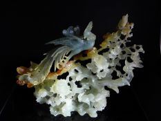 Chinese 20th Century Celadon, Amber and Blue Jade Carving of a Phoenix, the splendid carving in