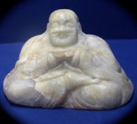 Chinese Antique Celadon Jade Figure of a Seated Buddha, the Buddha carved from a large boulder,