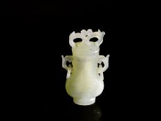 Chinese Qing Dynasty Pale Celadon Jade Vase and Cover, the pear shaped vase features white