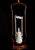 Chinese Qing Dynasty White Jade Suspended Vase and Cover, the pear shaped vase featuring carved