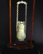 Chinese Qing Dynasty Pale Celadon Suspended Jade Vase and Cover, the pear shaped vase with white